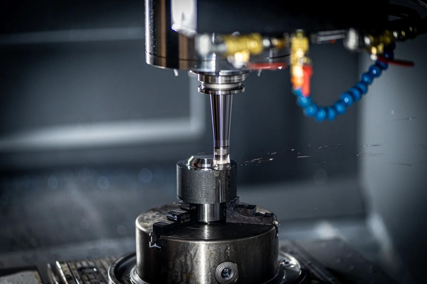 CNC tooling operation in a precision manufacturing line